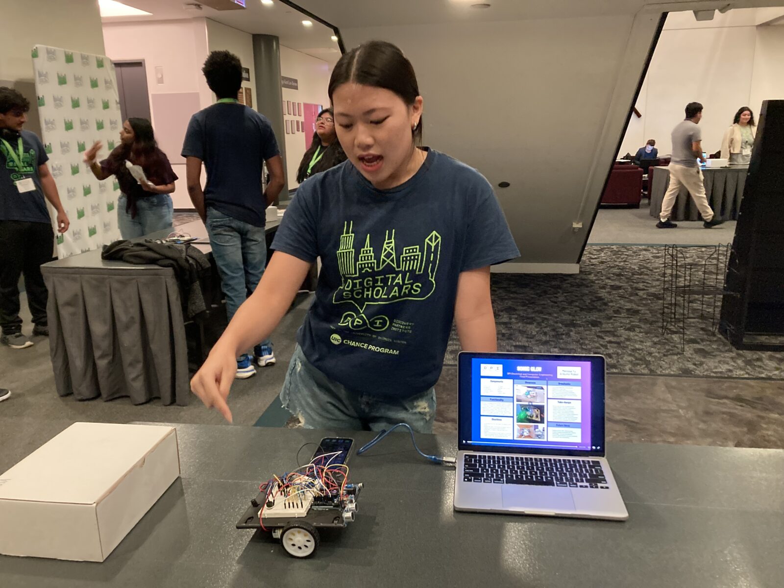 Melissa Yu presents her robot, Sonic Glow, at the Gallery Walk