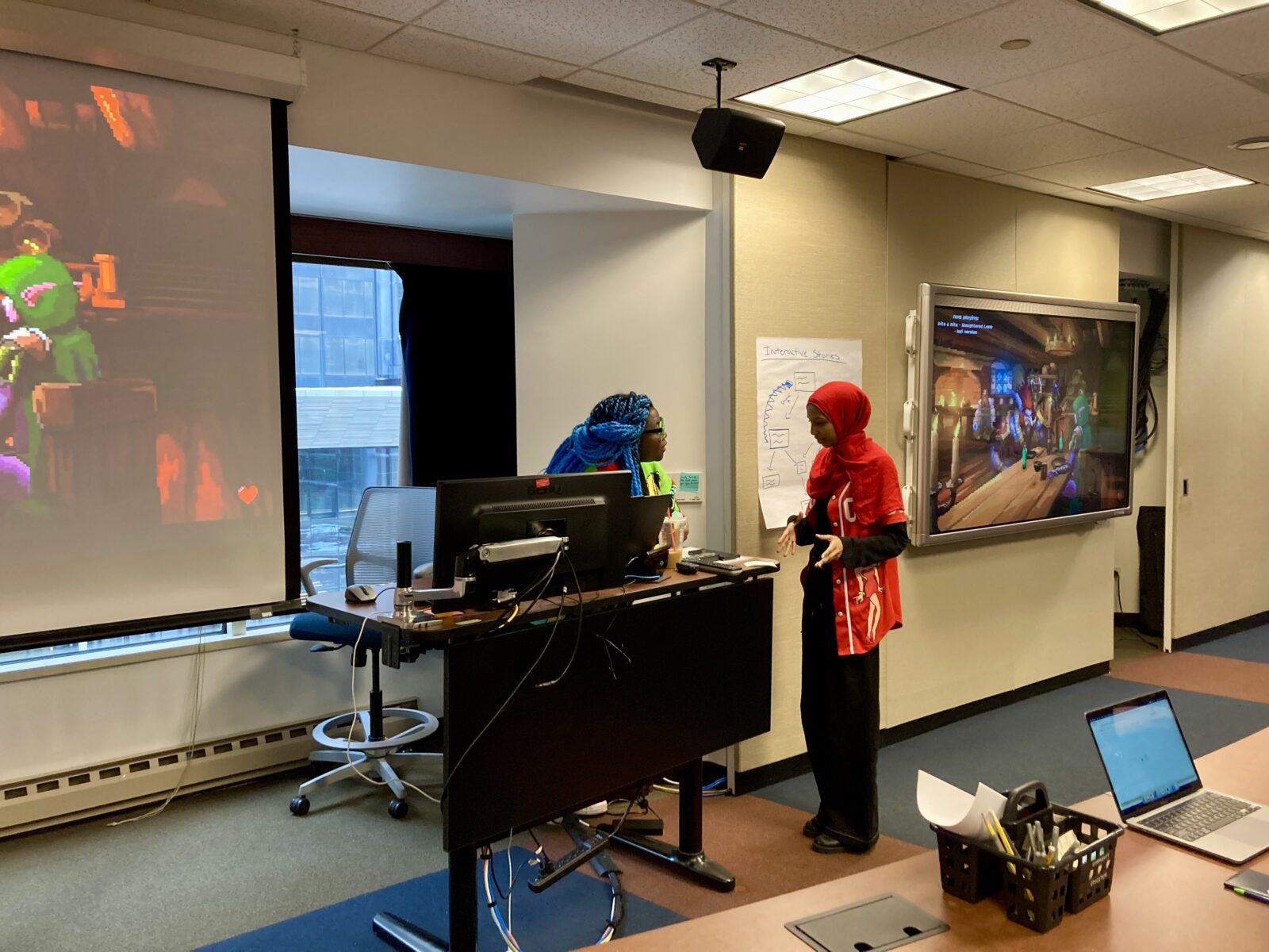 Ashlyn Sparrow consults with Mena Mohammed, a tenth grader at Senn High School in Chicago.