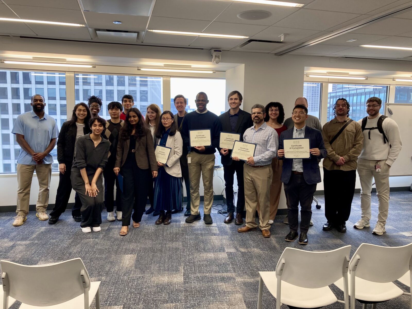 Newest trainees, program alumni and DPI staff at the showcase.