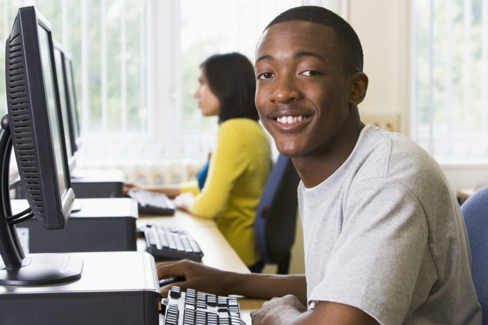 Young man working in computer lab
