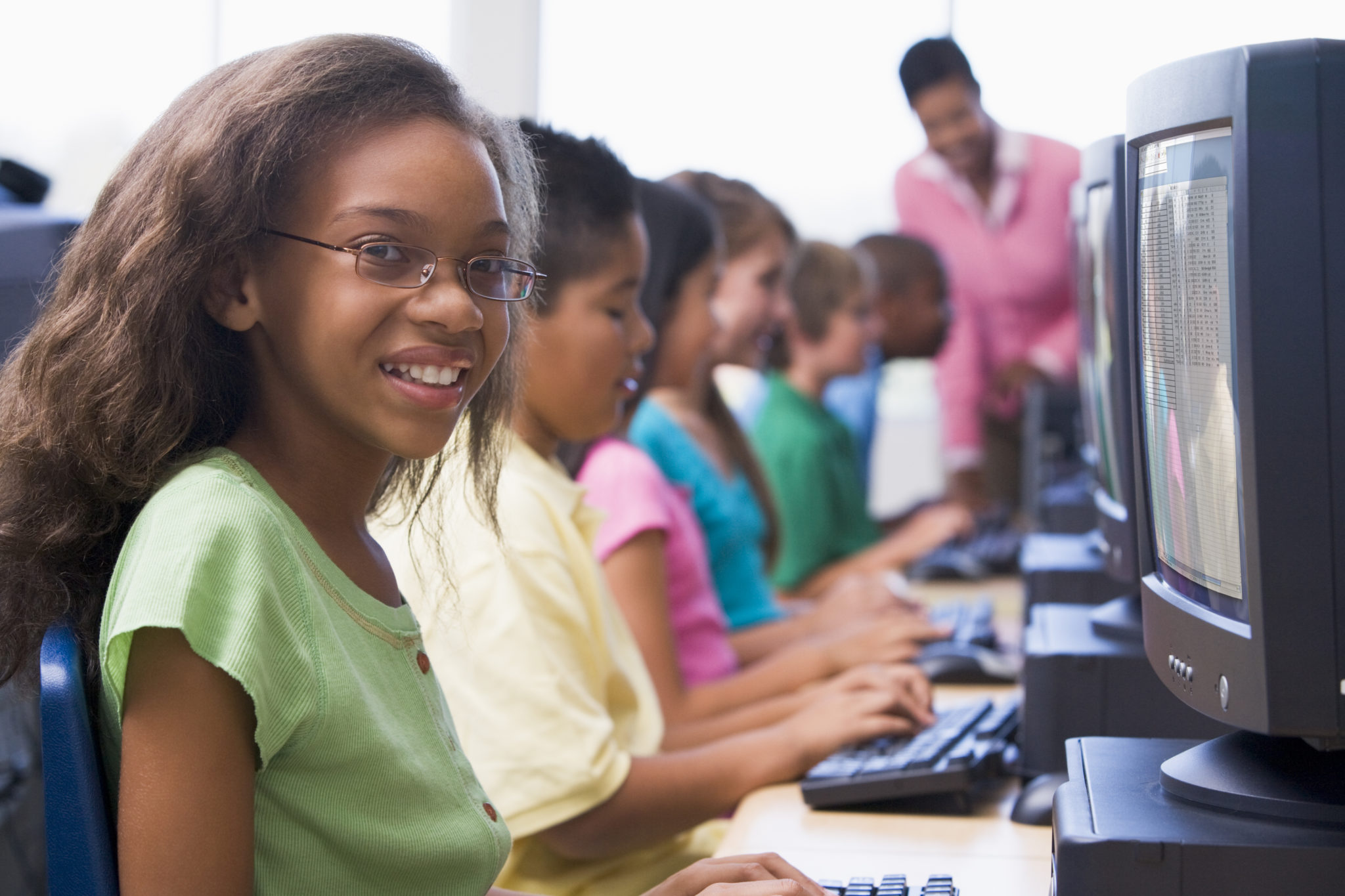 Female pupil in elementary school computer class.